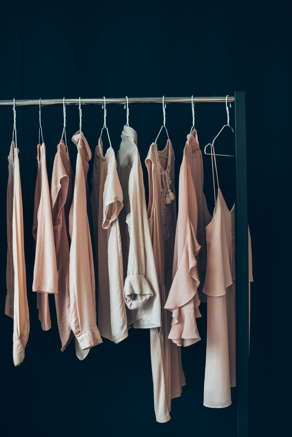 clothing hanging on clothes rack